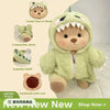A soft green dinosaur jumpsuit outfit for a teddy bear doll with interactive joints and a zipper.