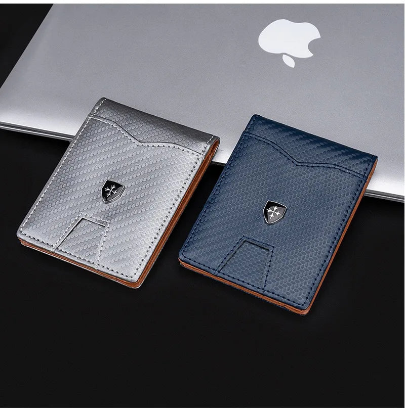 A silver and dark blue slim wallet with a carbon fiber texture is displayed on a black surface.