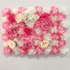 A dense wall panel of pink and white silk rose flowers for weddings and events.