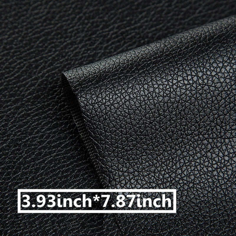 A close-up of a black leather repair patch, showing the texture and dimensions.