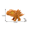 A small, orange interactive finger biting dinosaur toy featuring a head and body.