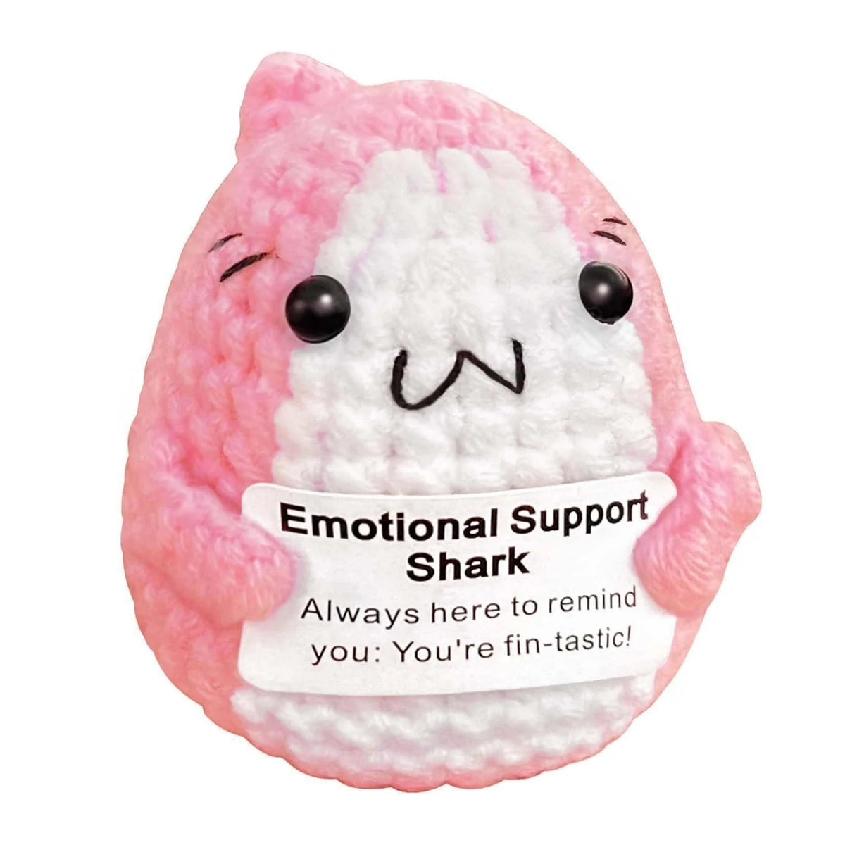 Pink shark plush ornament with black eyes and a smiling expression