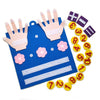 A blue felt board with pink handprints and yellow counting tiles, including numbers 1 through 10.