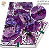 Purple and pink glitter African wax print fabric featuring floral patterns