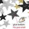 A collection of black and gold glitter rhinestone star patches for clothing and accessories.