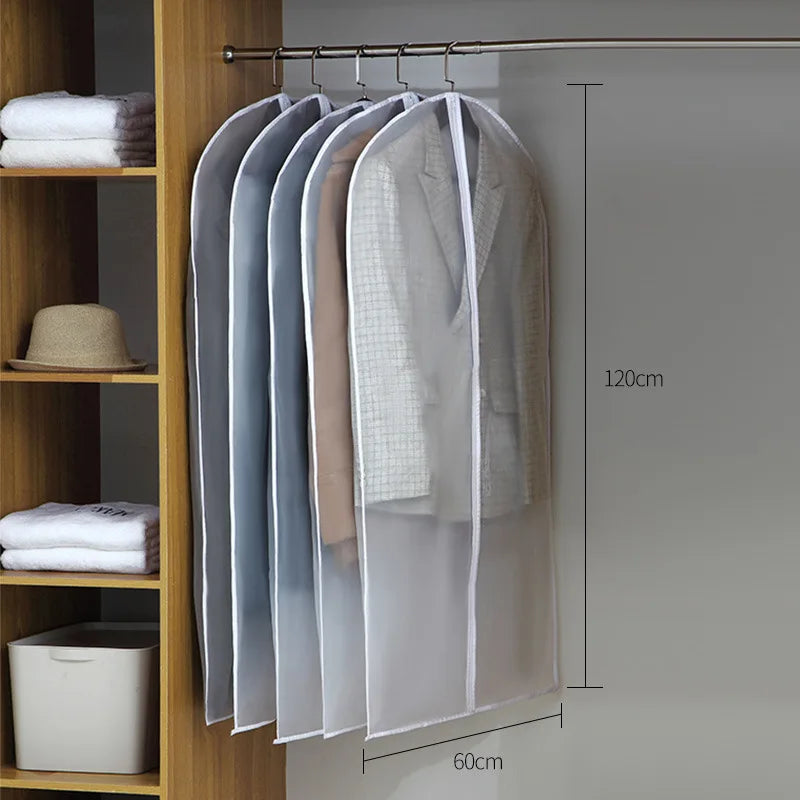 A transparent zippered garment bag with a hanger is displayed on a wooden shelf, showing its size and storage capacity.