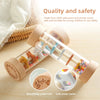 A wooden rain rattle toy made from child-safe paint and sturdy wood, showing its texture and safety features.