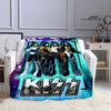 A plush blanket featuring a graphic print of the Kiss band members in various costumes and poses.