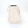 A beige breathable 2-in-1 car seat cover and mosquito net for babies with a padded back