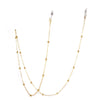 Gold chain necklace with a hollow pendant designed to look like stars and the moon