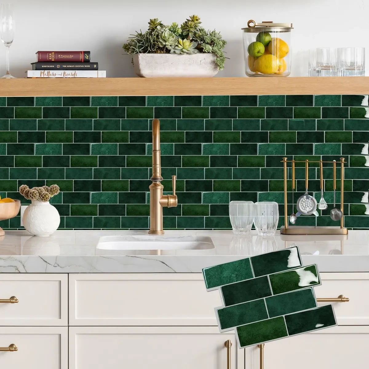 A kitchen countertop featuring a green subway tile backsplash, white marble, and gold fixtures.