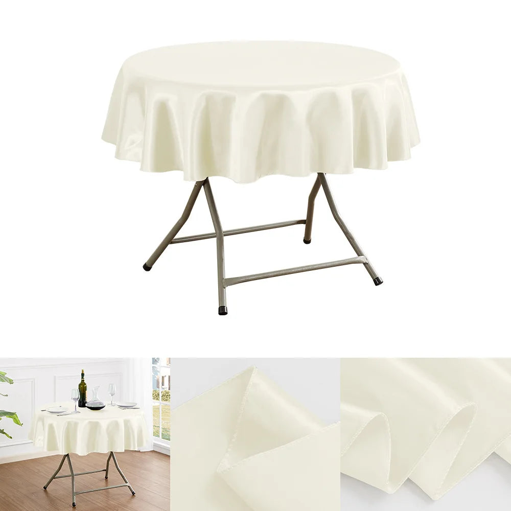 A round table draped with a luxurious cream satin tablecloth and supported by a metal stand.