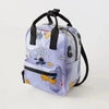 A purple and white patterned nylon backpack featuring a cute cow print design.