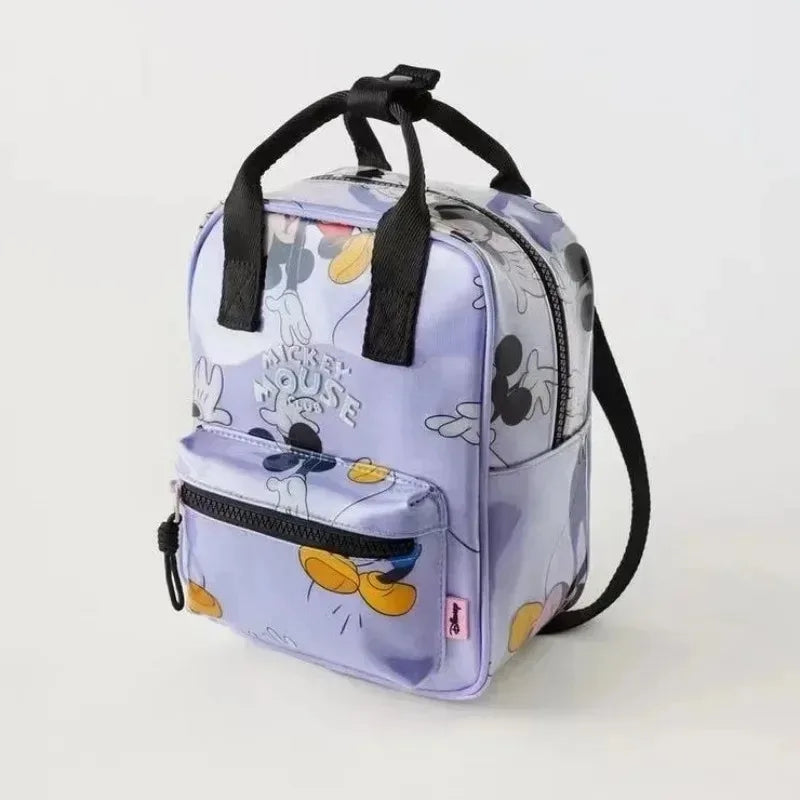 A purple and white patterned nylon backpack featuring a cute cow print design.