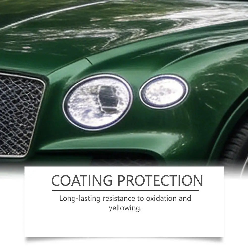 Close-up of a green car's headlight with a protective coating applied, showing resistance to oxidation and yellowing.