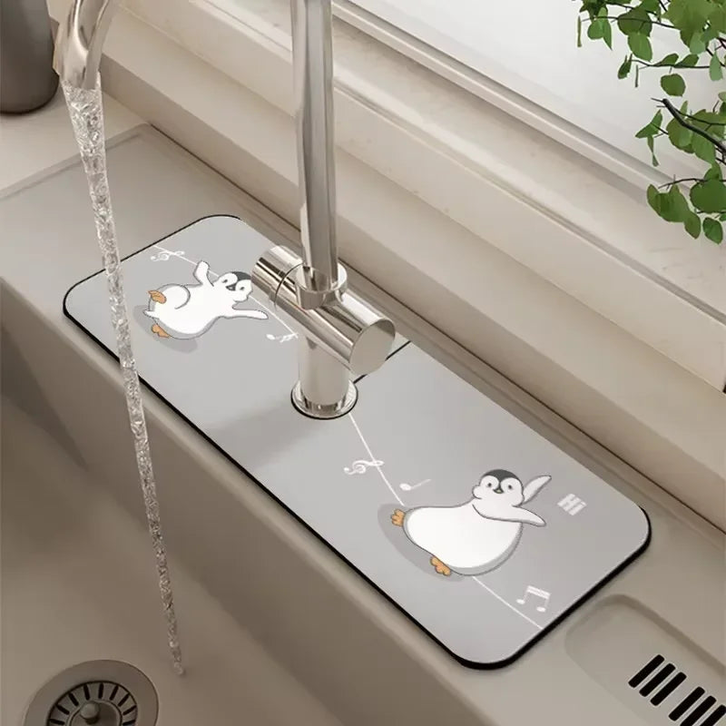 A silver faucet mat with a white rabbit and penguin design is installed on a sink.