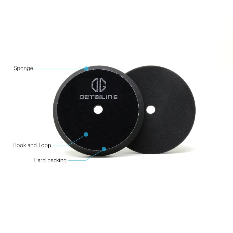 Black foam polishing pads for car detailing showing the sponge, hook and loop, and hard backing.