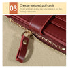 A close-up of a maroon PU leather wallet with a gold zipper pull and card slots.