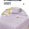 A purple floral quilted bedspread with a textured pattern is displayed on a bed, featuring a dust-proof cover.