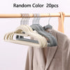 20 pieces of random color premium velvet non-slip hangers hanging on a wooden rod.