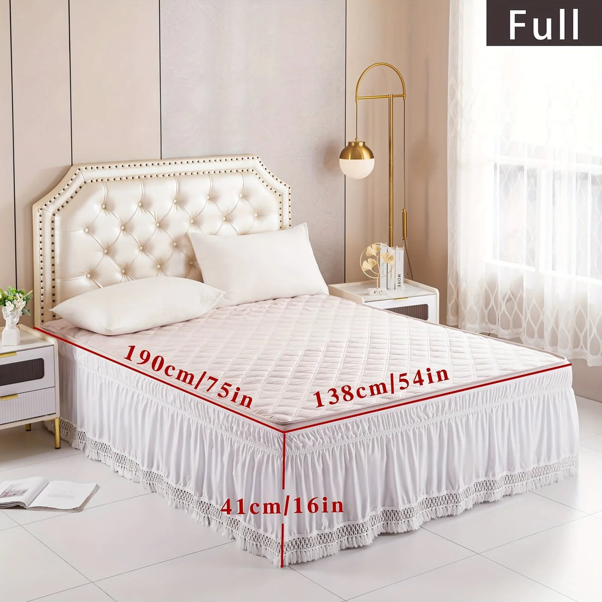 A white quilted bed with a high headboard and ruffled skirt featuring lace trim.