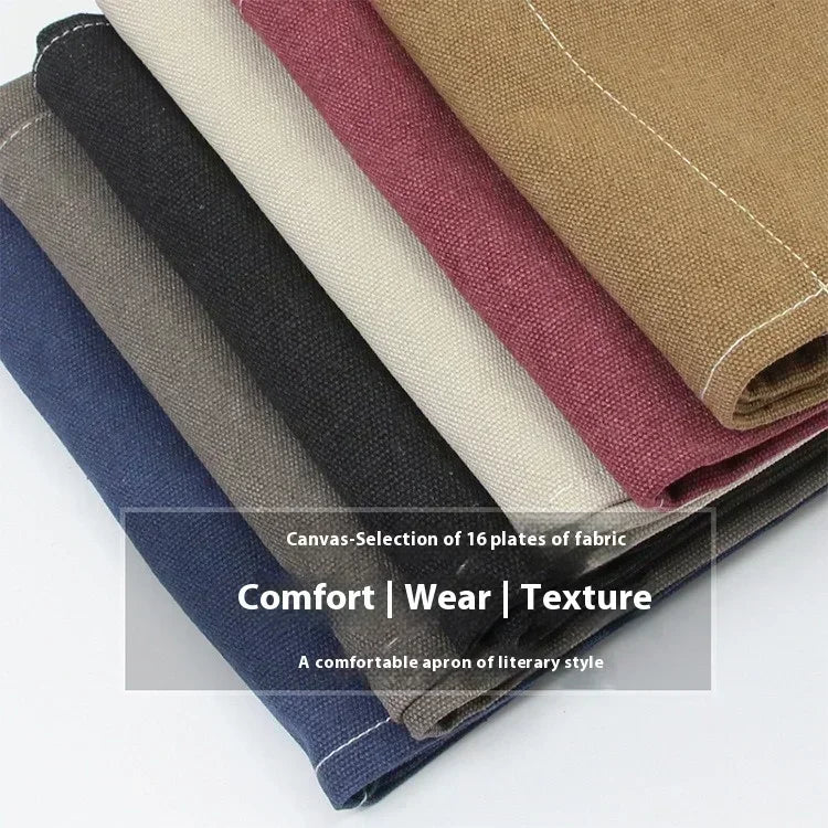 A selection of sixteen folded fabric cloths in various earthy and muted tones for a canvas apron.