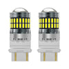 A pair of LED turn signal and reverse light bulbs with clear glass lenses and silver bases.
