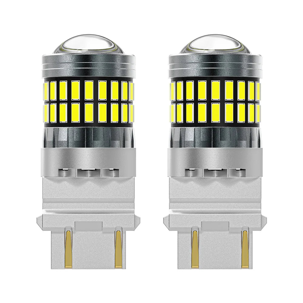 A pair of LED turn signal and reverse light bulbs with clear glass lenses and silver bases.