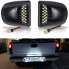 A close-up of an 18-LED license plate light assembly for Chevy Silverado and GMC Sierra trucks.
