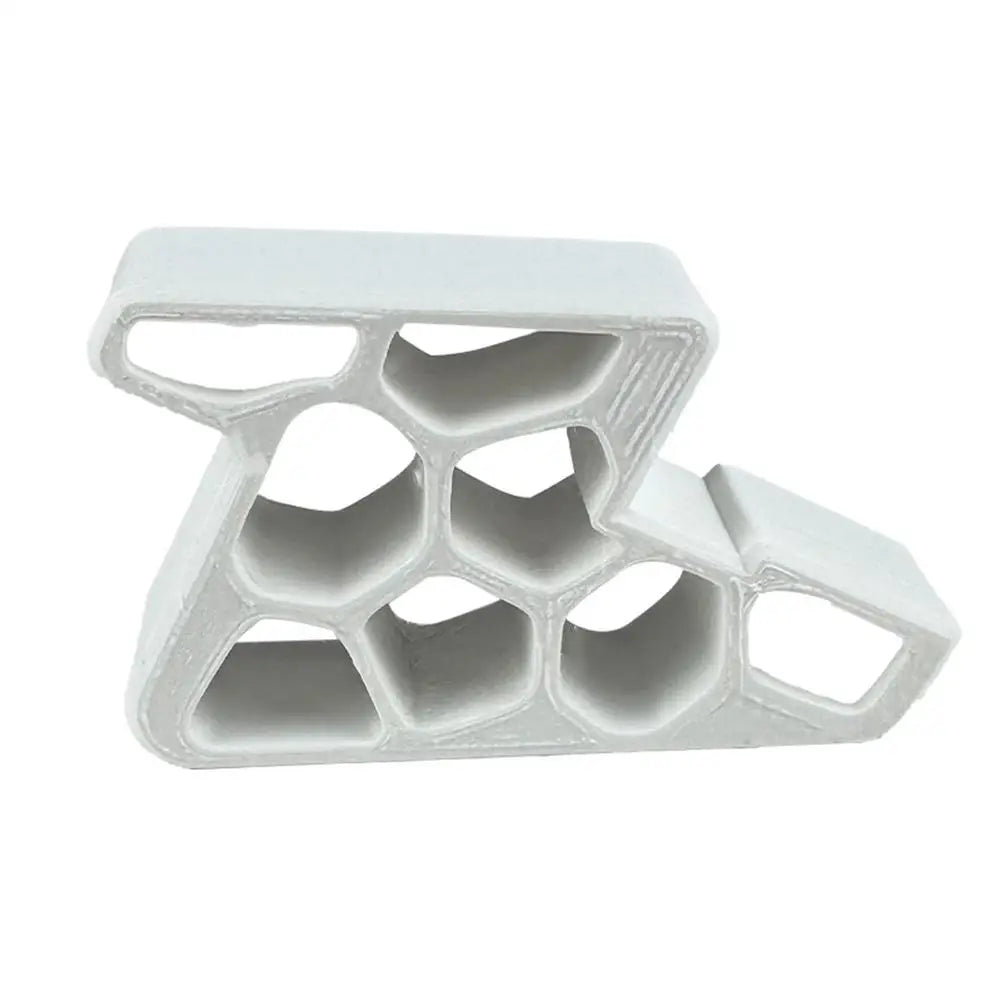 A white heavy-duty non-slip door stopper wedge with a honeycomb-like structure.