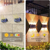Solar powered LED wall lights automatically charge during the day and light up at night
