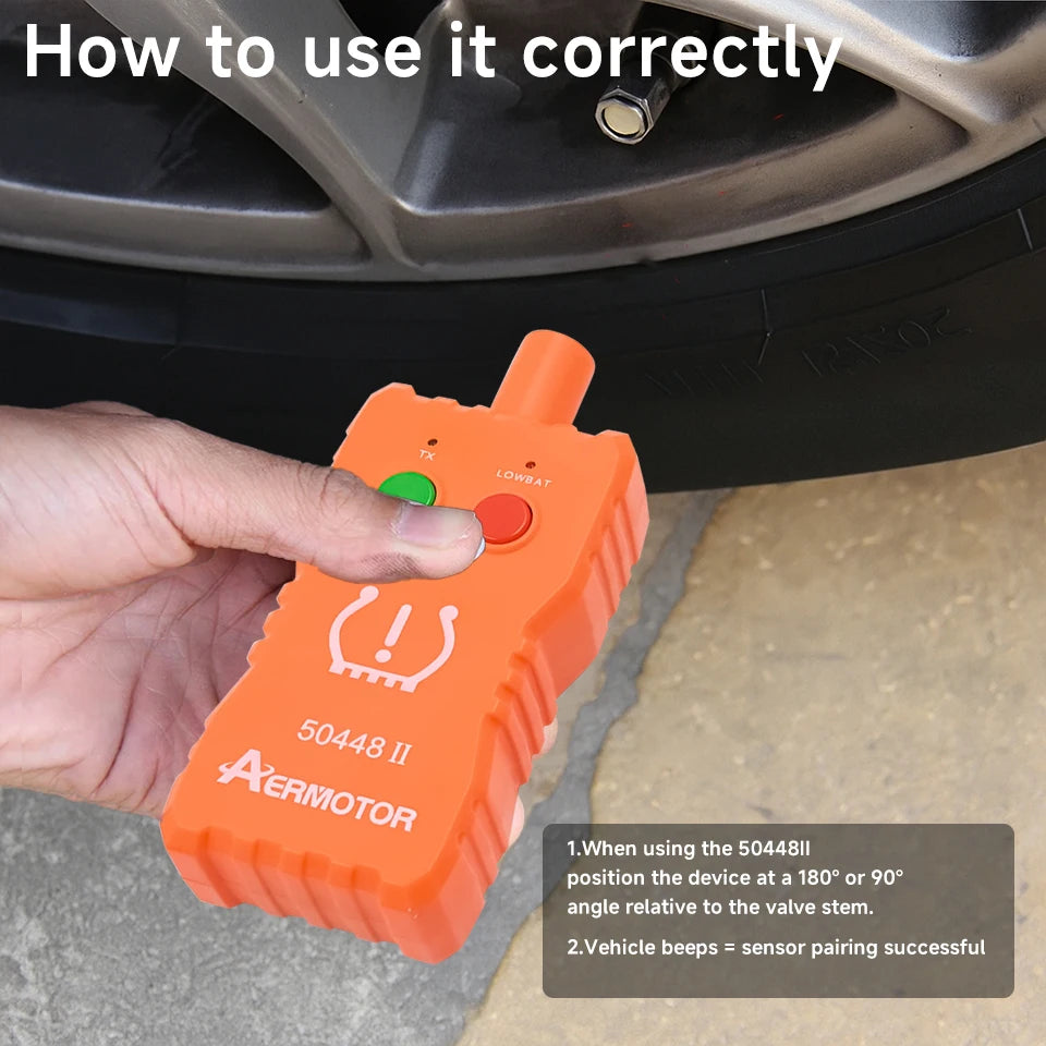 An orange 2-in-1 TPMS relearn tool is shown being used on a vehicle wheel.