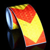 Roll of high-visibility reflective safety tape featuring a red and yellow chevron pattern.