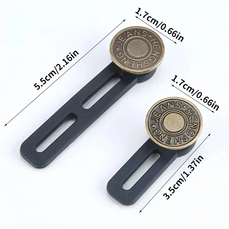 A pair of black metal jeans button extenders with brass accents shown with dimension lines.