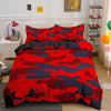 A red, blue, and black camouflage duvet cover set displayed on a bed with white furniture.