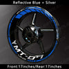 Reflective blue and silver custom rim decals for a motorcycle wheel.
