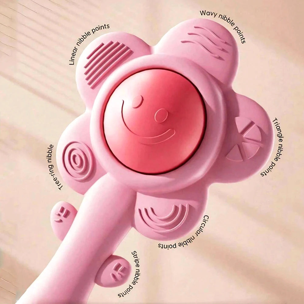 A pink 3-in-1 baby teething rattle toy showing various nipple points for sensory play.