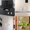 A collection of modern safety locks installed on kitchen cabinets and doors, featuring silver and black finishes.