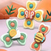 Colorful insect-themed suction cup bath toys featuring bees and butterflies on a pink background.