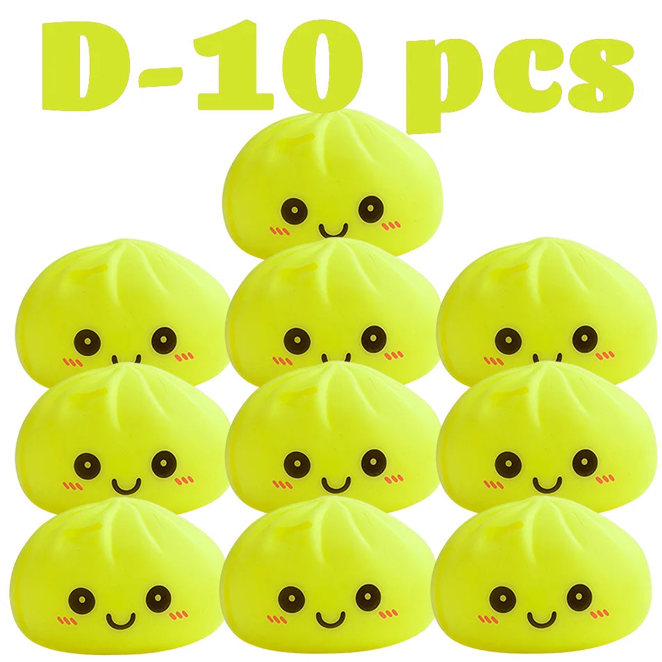 Juguetes blandos amarillos brillantes con forma de dumplings sonrientes