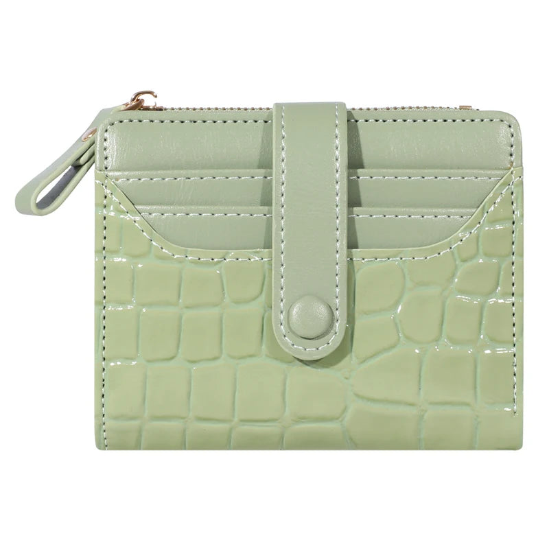 A light green PU leather wallet with a crocodile texture and a flap closure.