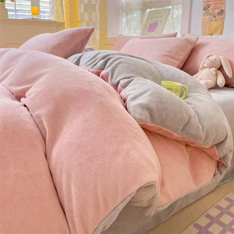 A pink and gray cozy milk velvet bedding set featuring a duvet cover and pillows.