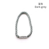 A set of two dark grey magnetic curtain tiebacks with rope and metal buckle clasps.