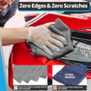 A hand wearing a gray cleaning cloth is wiping a red car surface, demonstrating zero edges and scratches.