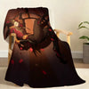 A dark throw blanket featuring a stylized illustration of Pierrot in a circus costume.