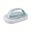 Light blue magic sponge scrubber with a long handle resting on a white sponge.