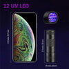 A smartphone displaying an iridescent background next to a black UV LED flashlight and its packaging.