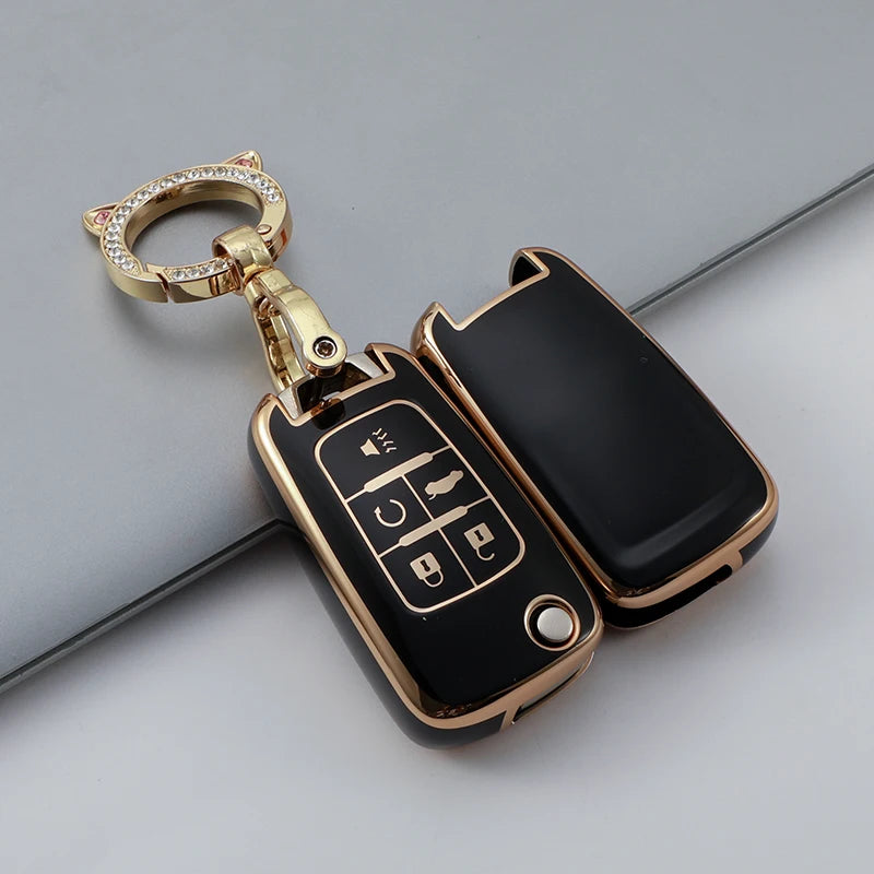 Gold-toned key fob cover with a keyring and electronic buttons for Chevrolet and GMC vehicles