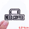 Black embroidered iron-on letter patch with the text NEED COFFEE on a white background