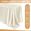 A smooth, ivory satin tablecloth draped elegantly on a table.